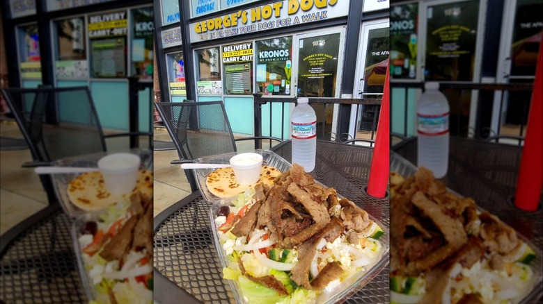 Greek gyro salad on the patio table outside of George's Hot Dogs