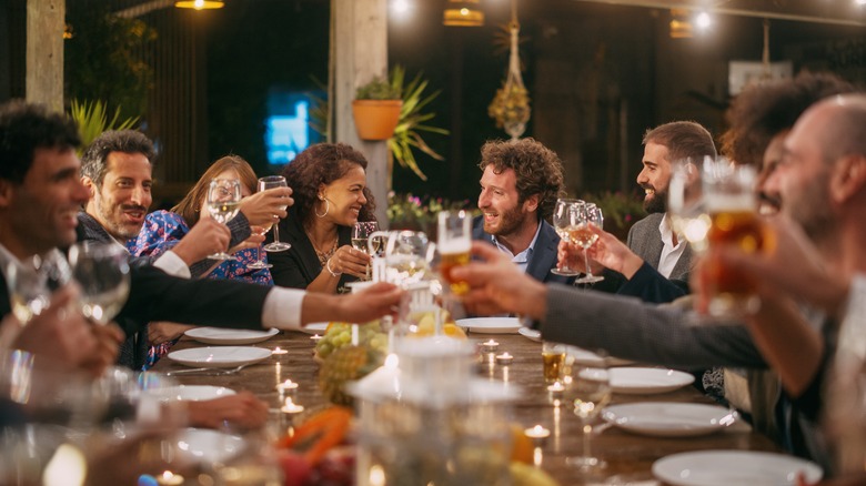 guests smiling at dinner party
