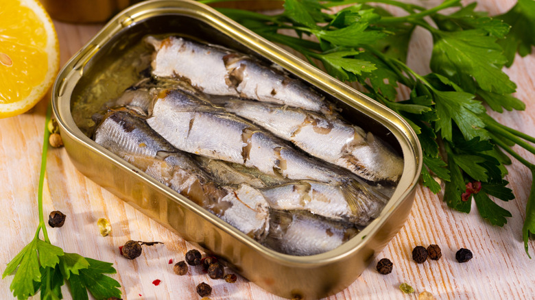 Can of open sardines on a table