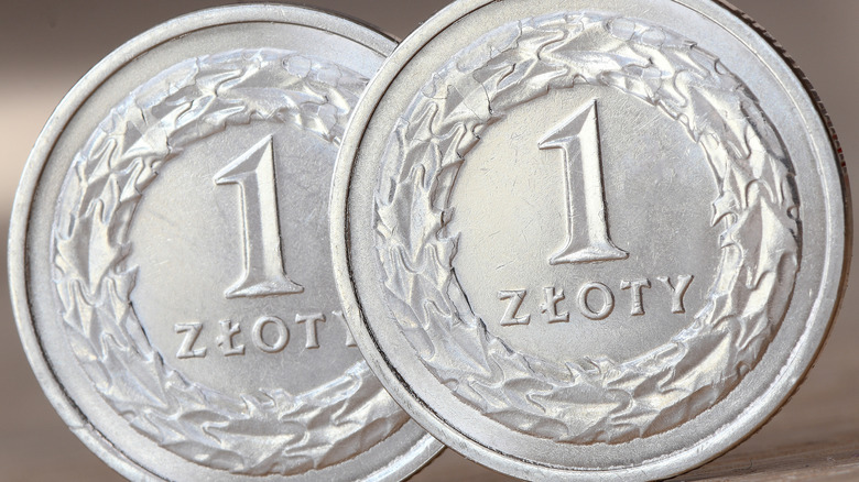 Close-up of two silver 1 zloty coins