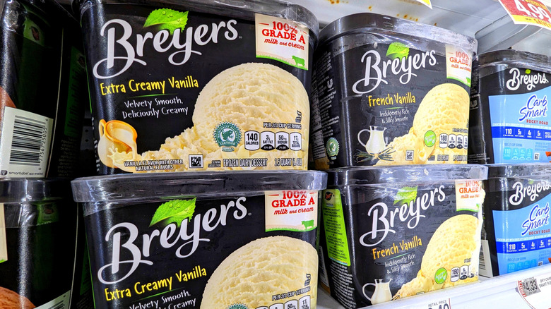 Various flavors of Breyers ice cream in a grocery store freezer