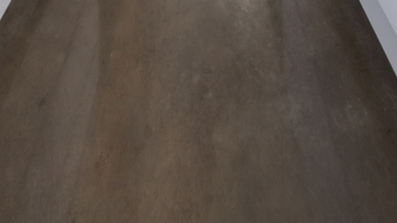 A shiny concrete floor in a clean white kitchen