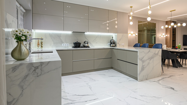 Gorgeous open kitchen with white marble floors