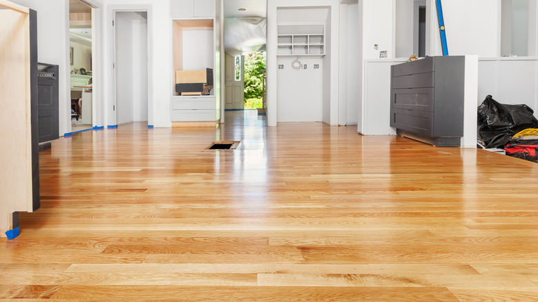 Light wooden floors in a kitchen that is being remodeled