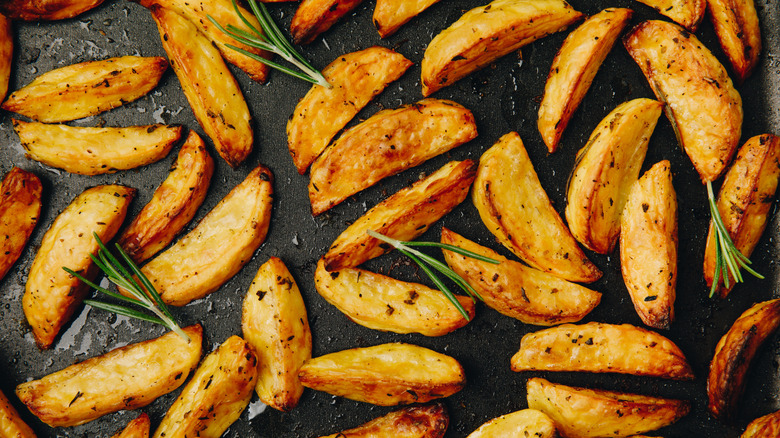 roast potato wedges on metal baking tray