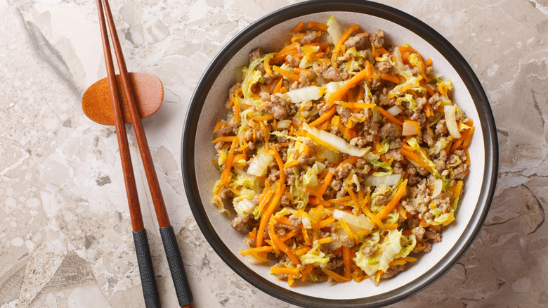 Egg roll in a bowl with chopsticks