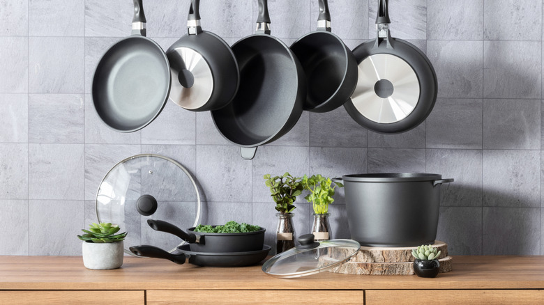 pans in kitchen hanging and on counter
