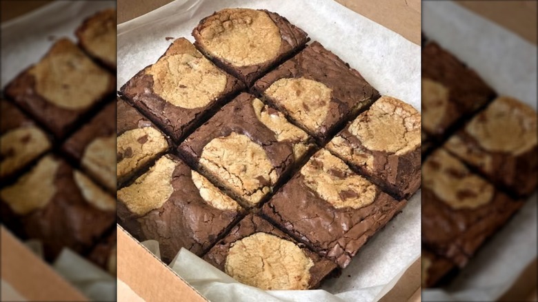 Marbled cookie brownies from Domino's on parchment paper in a wooden box