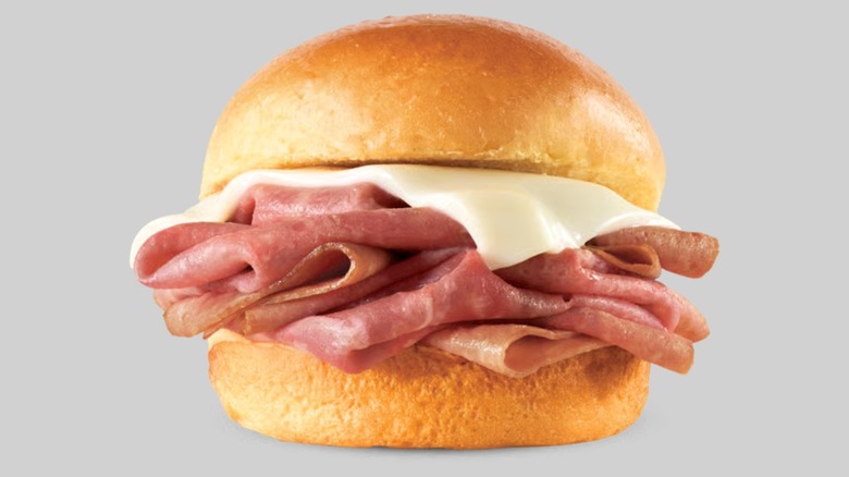 Deli-sliced roast beef is layered on a mini hamburger bun and topped with a single slice of cheese