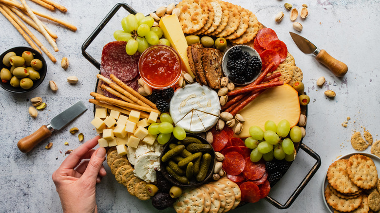 Charcuterie board with mixed fruits