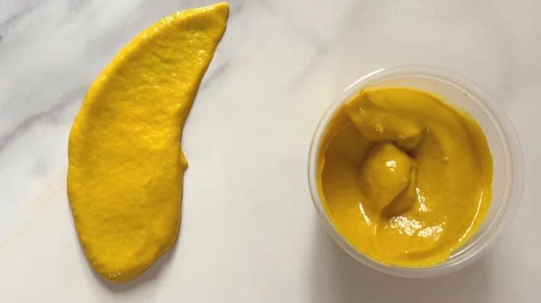 Subway mustard on table and in dish