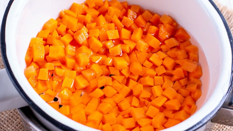 Close-up of carrot cubes in a colander