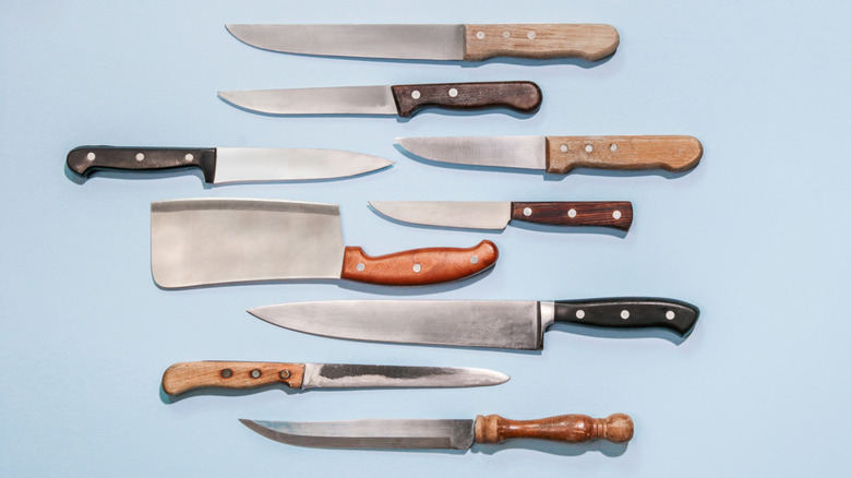Set of knives against a blue background