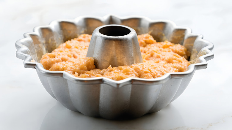 A Bundt pan filled with thick cake batter