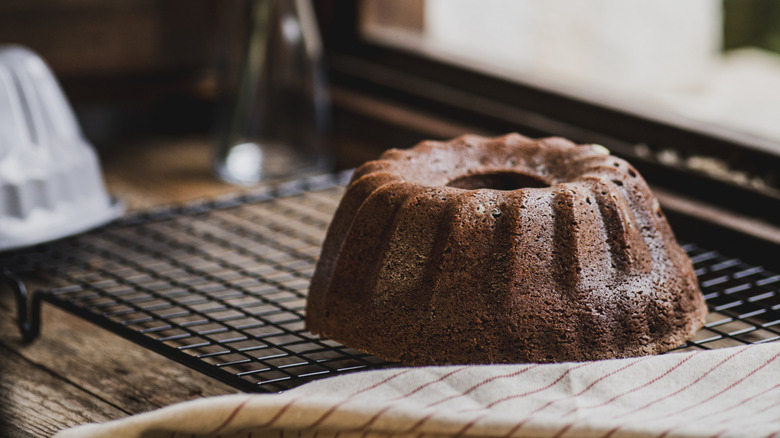 An unmolded bundt cake on a cooling rack
