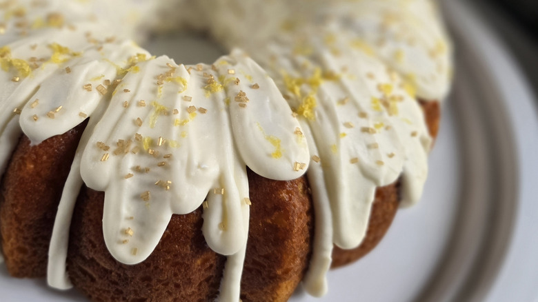 A close up of a Bundt cake with thick frosting