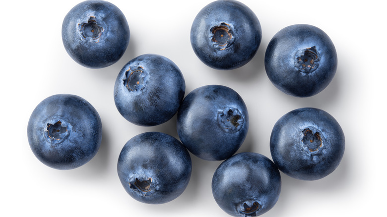 Shiny blueberries on white background