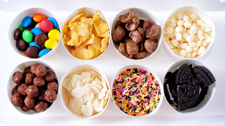 different ice craem toppings in bowls
