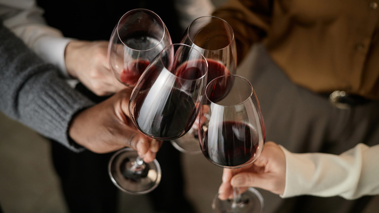 women toasting with glasses of wine