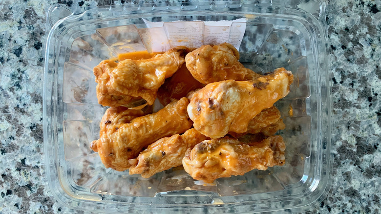 Buffalo wings in a plastic container