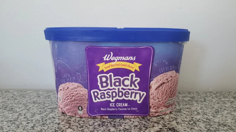 Tub of Wegmans black raspberry ice cream in a counter