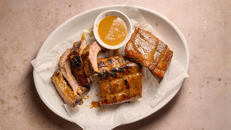 sliced ribs on a platter