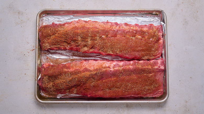 rubbing the ribs with spices