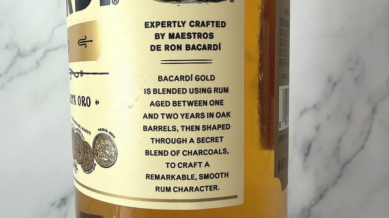 Side label of Bacardi Gold bottle detailing production process