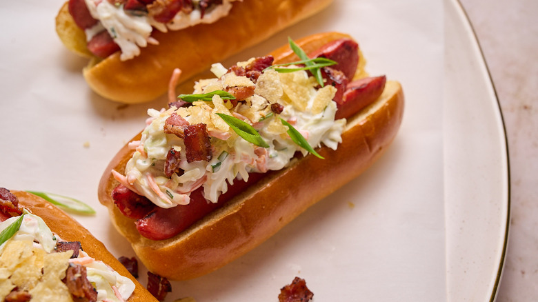 hot dog with coleslaw on table