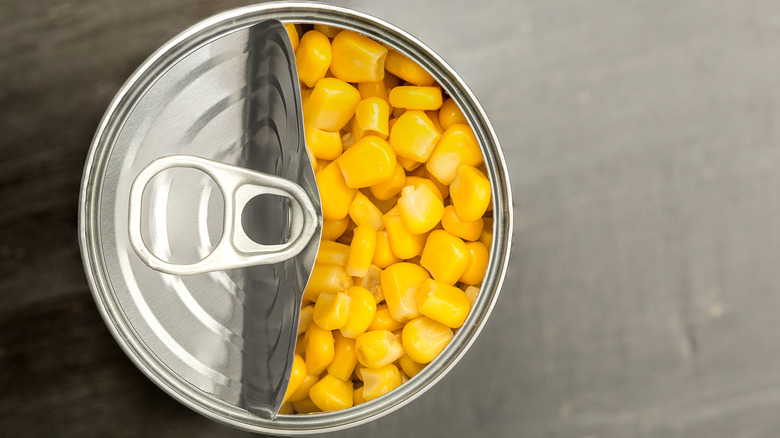 Top view of an opened can of corn