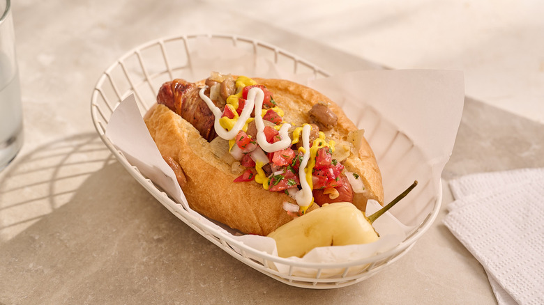 bacon wrapped hot dog in a basket