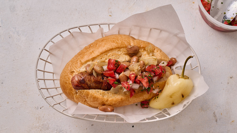 hot dog with pico and beans on top