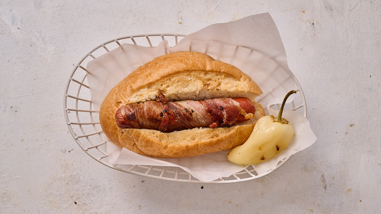 adding hot dogs into buns