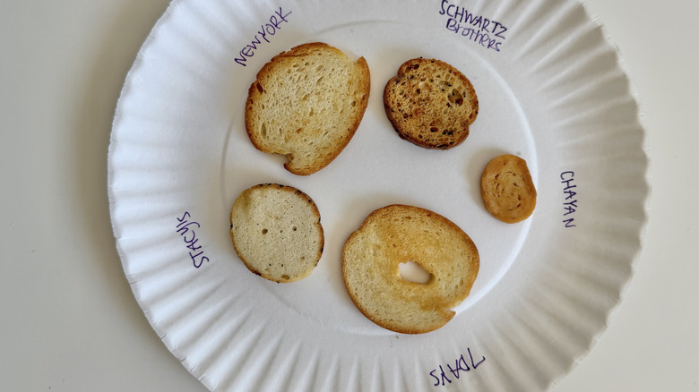 Five bagel chips on a paper plate
