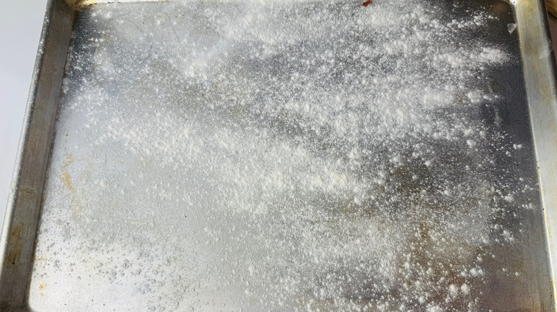 Baking sheet with sprinkling of flour