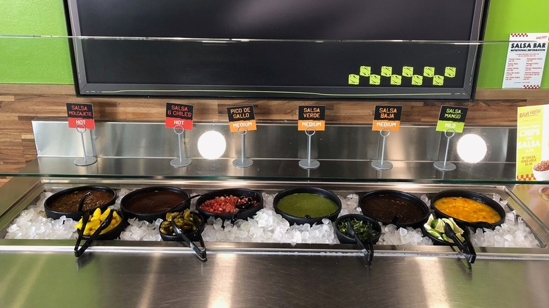 Display of Baja Fresh's salsa bar offerings