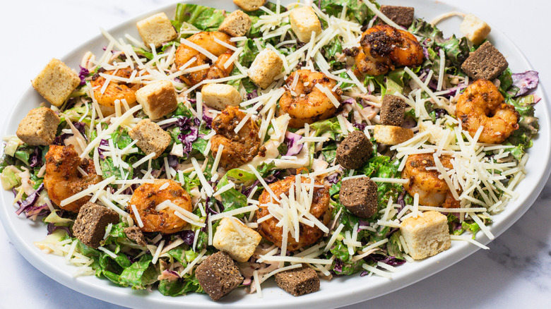 Serving platte with Baja shrimp Caesar salad.