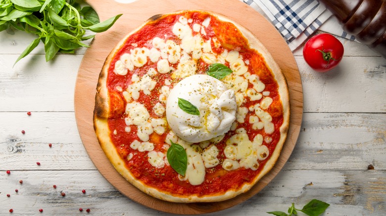 pizza topped with burrata cheese