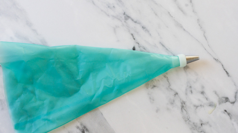 Piping bag with tip on.