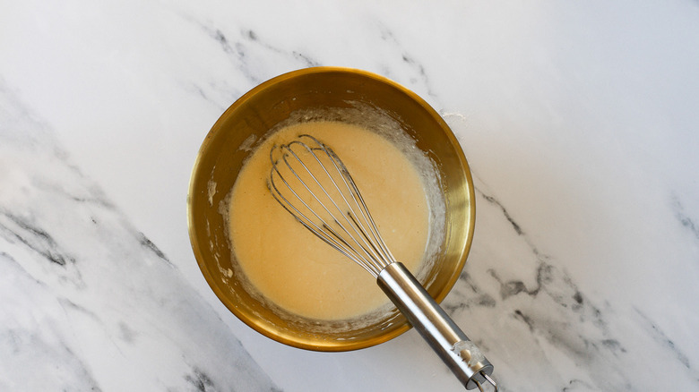 Whisked wet ingredients in bowl.