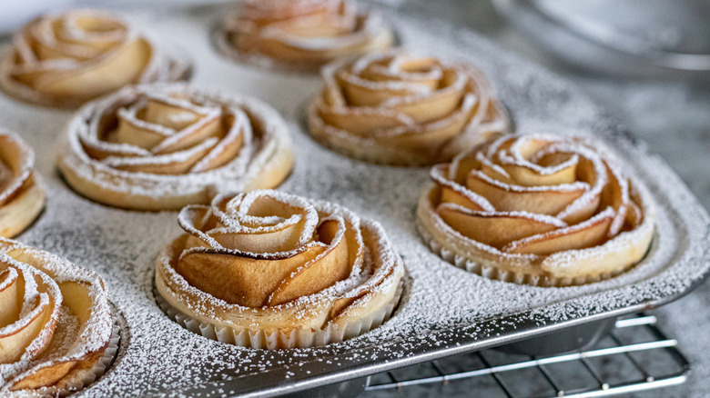 baked cinnamon apple roses dusted with powdered sugar