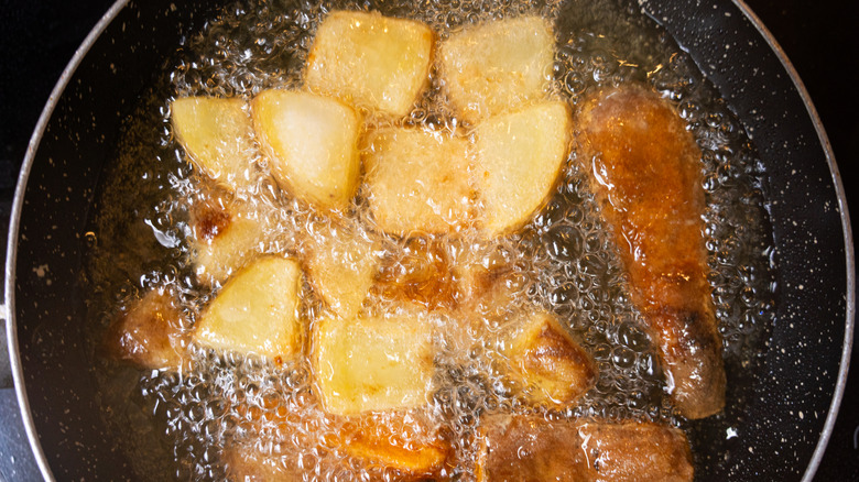 Potatoes frying in a hot pan