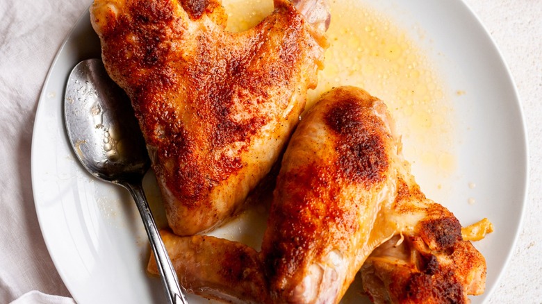 baked turkey wings with spoon