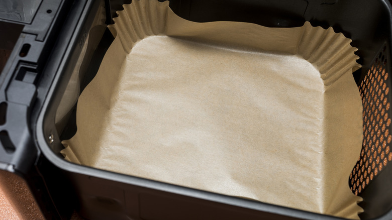 Air fryer liner in an air fryer basket