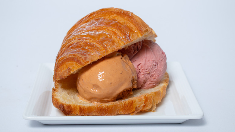Scoops of ice cream served inside a croissant