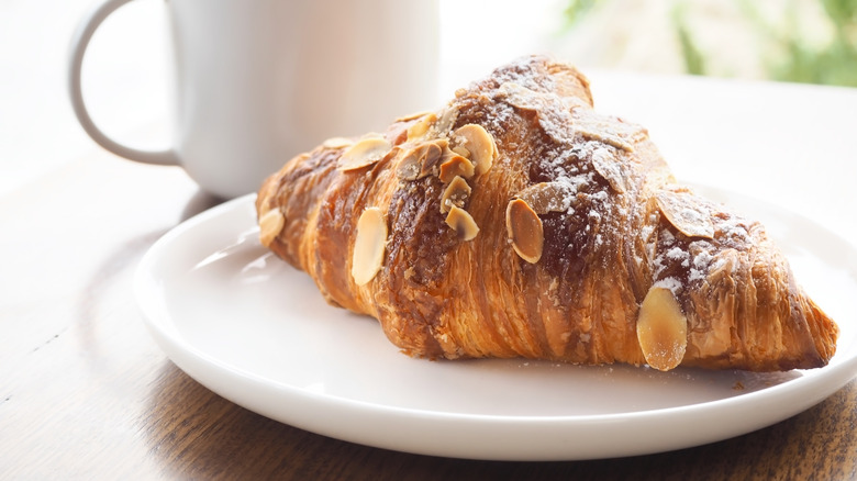 Almond croissant on a white plate