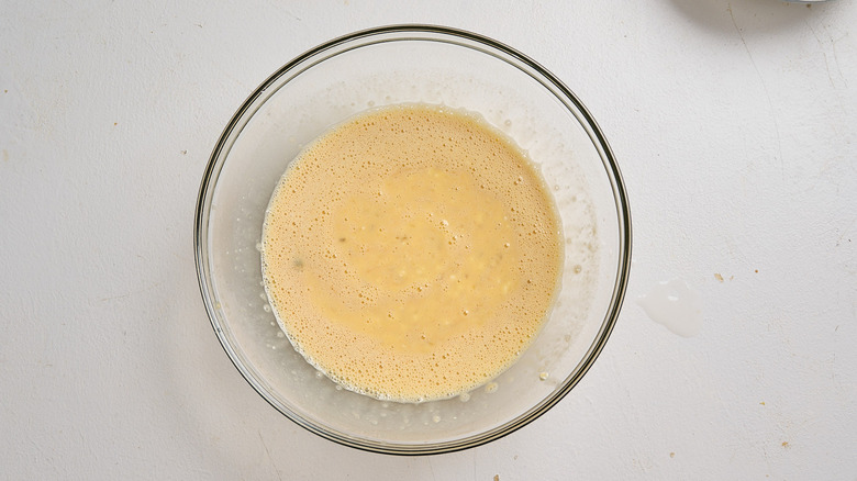 Liquid ingredients whisked into bowl