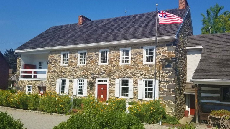 Exterior of the stone Dobbin House Tavern building on a sunny day