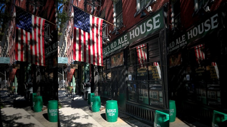 Exterior of McSorley's Old Ale House with an American flag