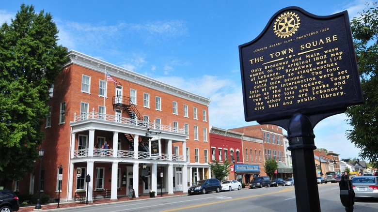 Exterior of The Golden Lamb brick building with a historical marker